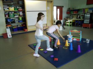 Two children doing gym activities