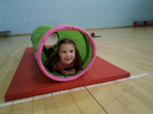 A child playing in a tube