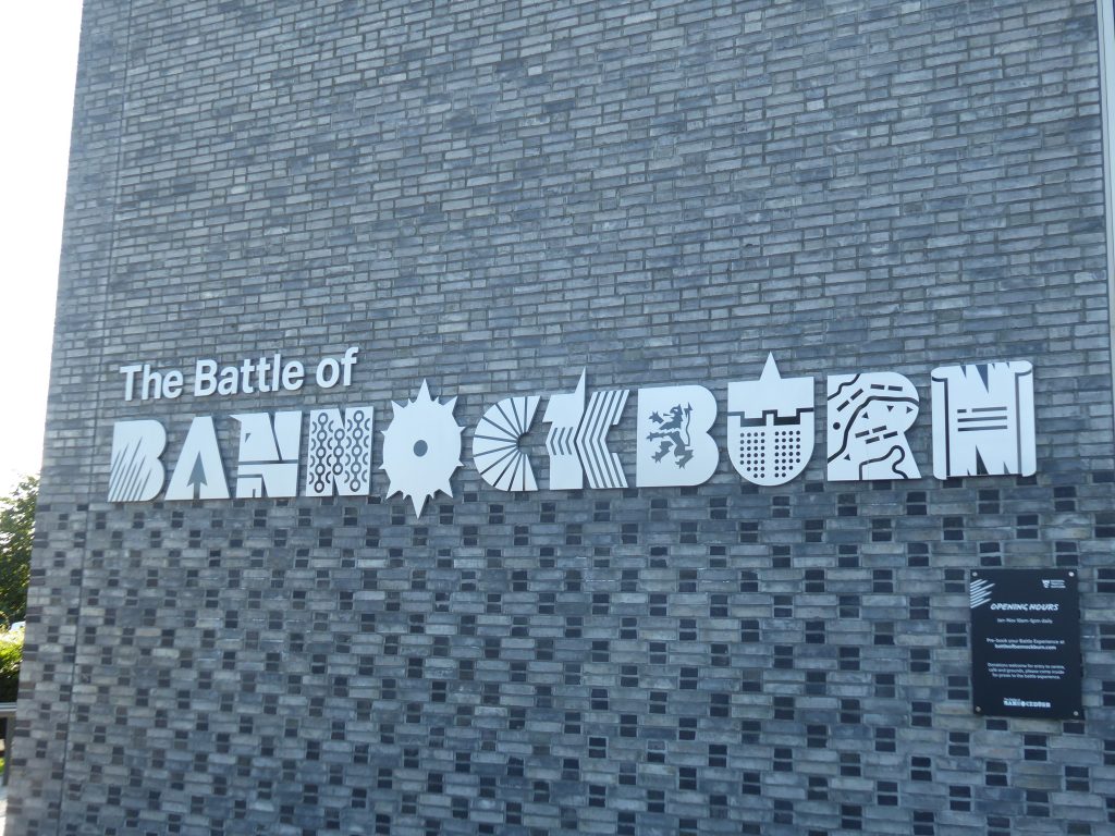 Side of a building that has metal letters reading 'The Battle of Bannockburn'