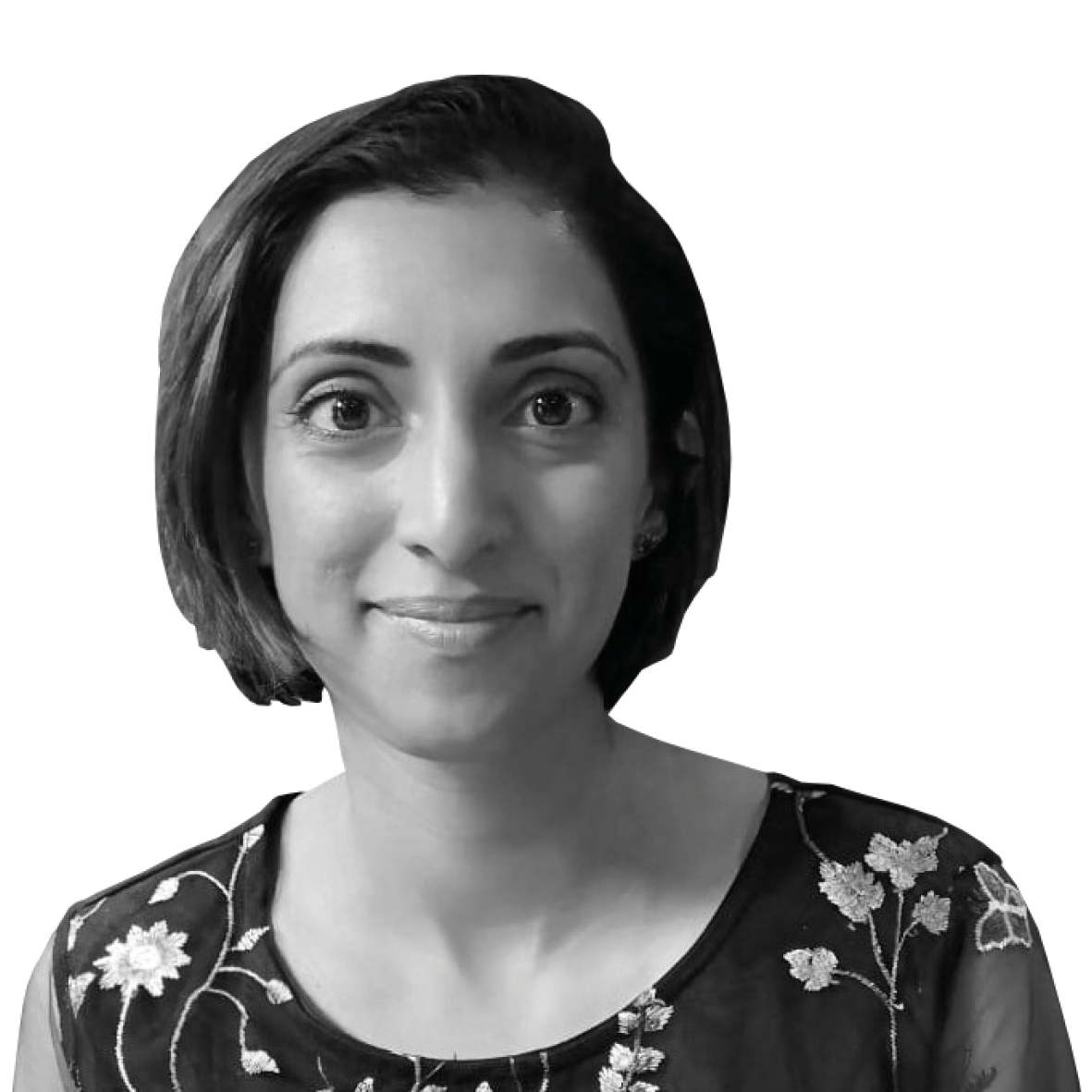 A black and white image of a woman from the shoulders up. She is smiling at the camera and has short straight dark hair.