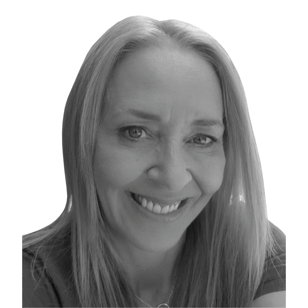 A black and white image of a woman smiling from the neck up. She has blond straight long hair and is looking at the camera.