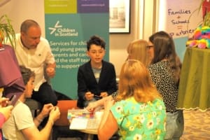 young people and Enquire staff at the Connect and Reflect space at AC25