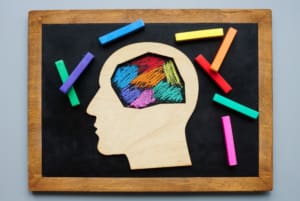 Colourful chalk drawing of a brain suggesting diversity