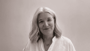 photograph of person with long hair smiling